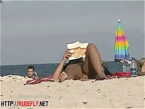super hot stunners filmed lounging on a nudist beach